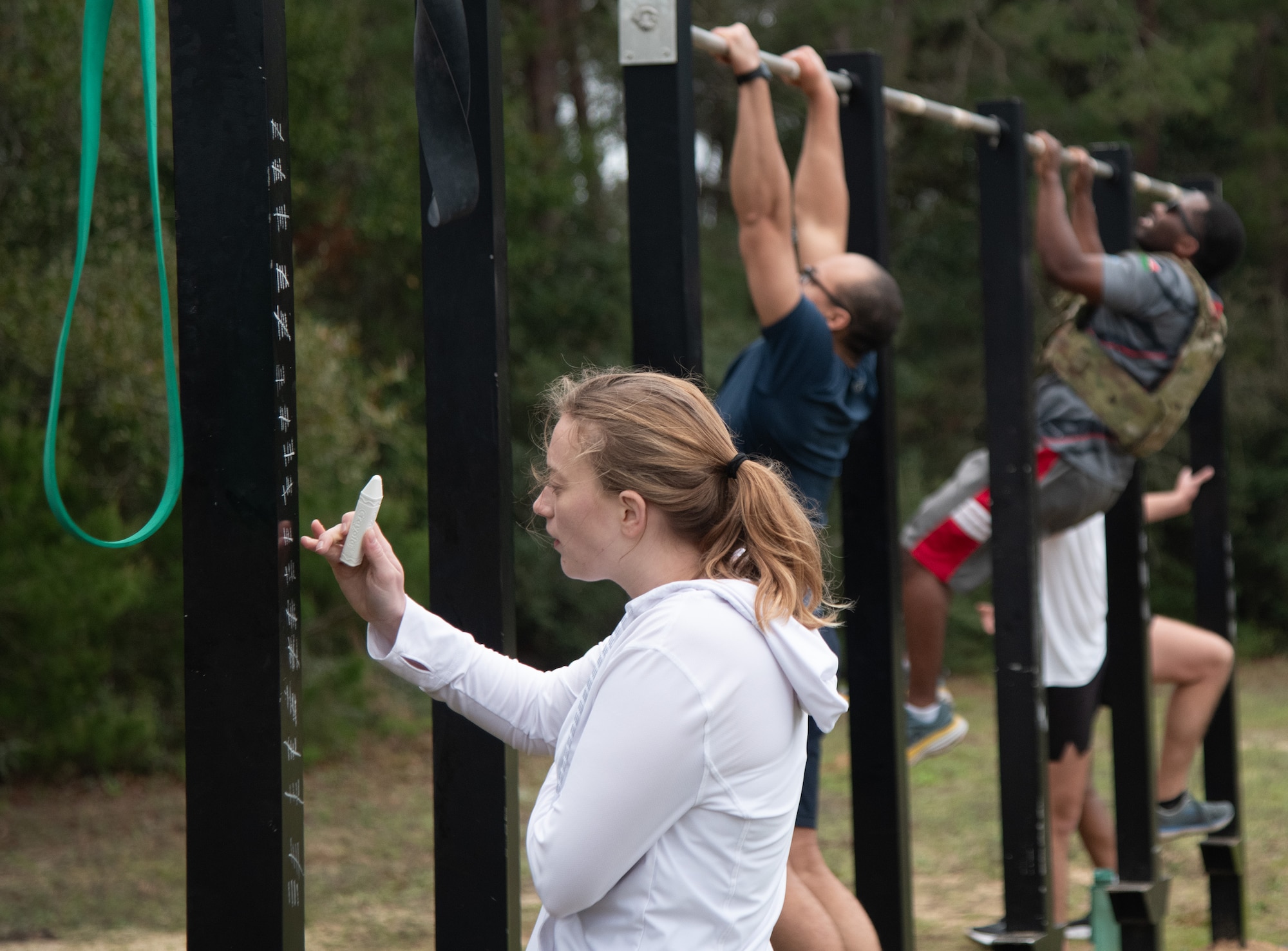 An Airman tracks reps during the Warrior Day Murph Challenge.