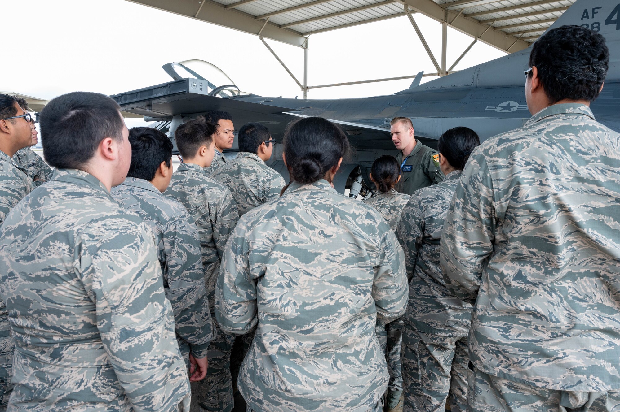 U.S. Air Force Capt. Daniel Frieson, 309th Fighter Squadron instructor pilot, gives a tour of an F-16C Fighting Falcon to Westwood High School Air Force Junior Reserve Officer Training Corps students, Mar. 7, 2024, at Luke Air Force Base, Arizona.