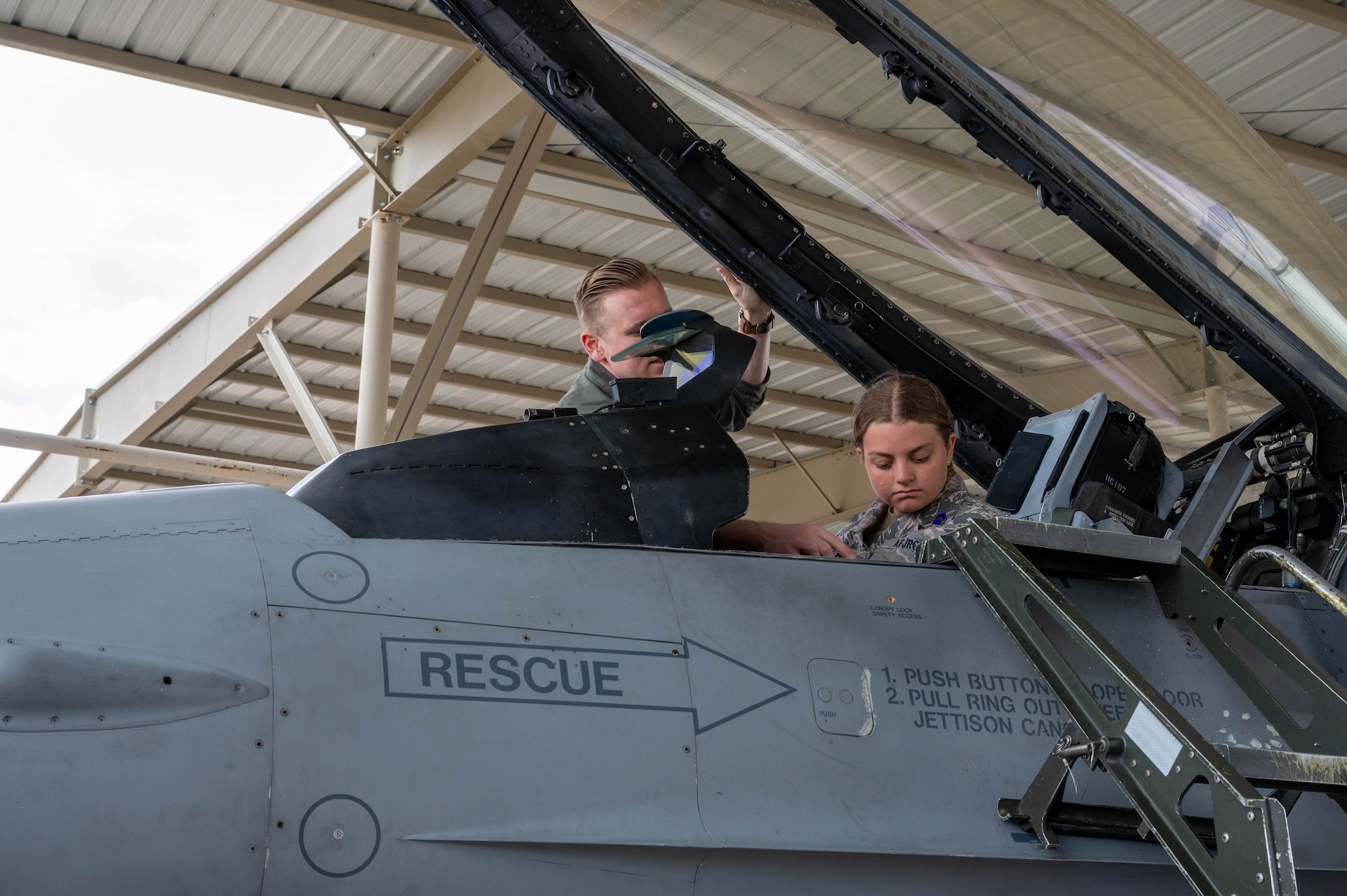 U.S. Air Force Capt. Daniel Frieson, 309th Fighter Squadron instructor pilot, gives a tour of an F-16C Fighting Falcon cockpit to a Westwood High School Air Force Junior Reserve Officer Training Corps student, Mar. 7, 2024, at Luke Air Force Base, Arizona.
