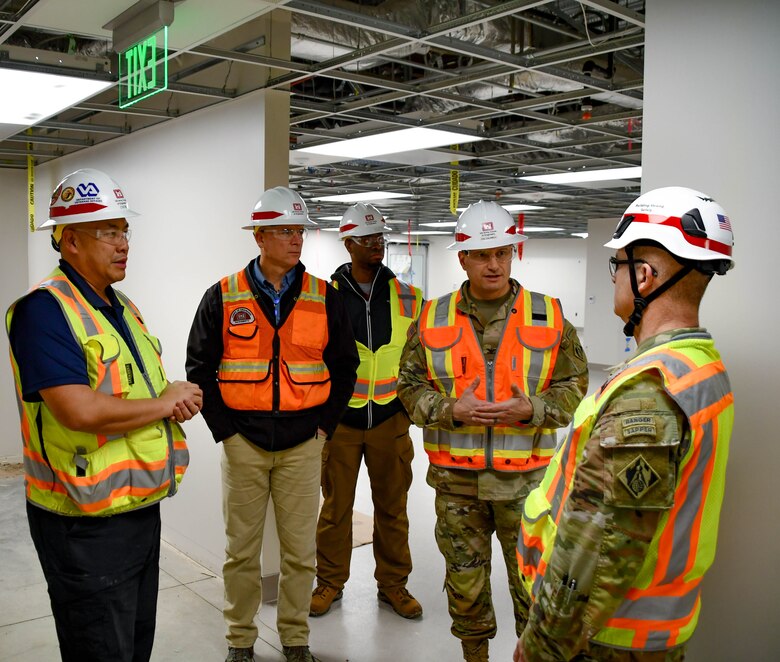 Col. Chad Caldwell, second from right, commander of the U.S. Army Corps of Engineers Sacramento District, speaks with Col. James Handura, commander of the USACE South Pacific Division, during Col. Handura’s visit to the VA Stockton Community Based Outpatient Clinic in Stockton, California.