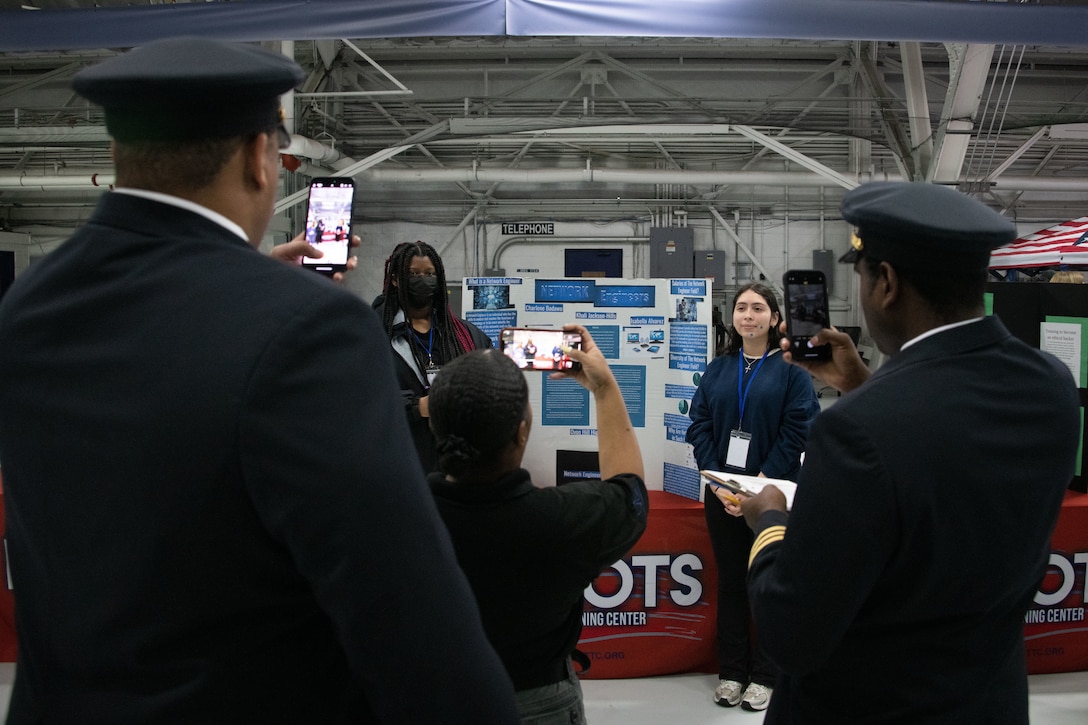 Judges review students' presentations during the annual Aerospace Summit at Joint Base Andrews, Md., March 6, 2024.