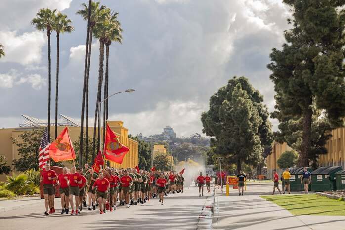 U.S. Marines with Delta Company, 1st Recruit Training Battalion, Recruit Training Regiment, carry the colors during a motivational run at Marine Corps Recruit Depot San Diego, California, Mar. 7, 2024. The motivational run is the last physical training event the Marines will conduct before they graduate from MCRD San Diego and is the first time the friends and families will see their new Marines. (U.S. Marine Corps photo by Lance Cpl. Janell B. Alvarez)