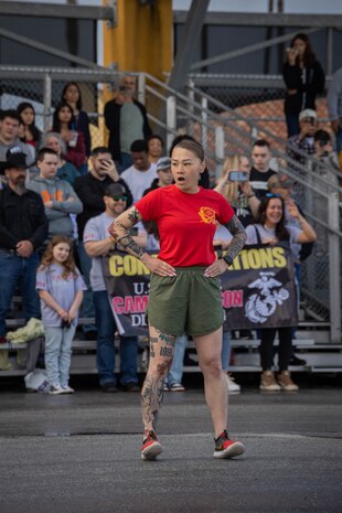 U.S. Marine Corps Gunnery Sgt. Phuong Tsan, a chief drill instructor with Delta Company, 1st Recruit Training Battalion, Recruit Training Regiment, leads warm-up exercises before a motivational run at Marine Corps Recruit Depot San Diego, California, Mar. 7, 2024. The motivational run is the last physical training event the Marines will conduct before they graduate from MCRD San Diego and is the first time the friends and families will see their new Marines. (U.S. Marine Corps photo by Lance Cpl. Janell B. Alvarez)