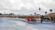 U.S. Marines with Delta Company, 1st Recruit Training Battalion, Recruit Training Regiment, execute push-ups before a motivational run at Marine Corps Recruit Depot San Diego, California, Mar. 7, 2024. The motivational run is the last physical training event the Marines will conduct before they graduate from MCRD San Diego and is the first time the friends and families will see their new Marines. (U.S. Marine Corps photo by Lance Cpl. Janell B. Alvarez)