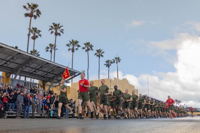 U.S. Marines with Delta Company, 1st Recruit Training Battalion, Recruit Training Regiment, run in formation during a motivational run at Marine Corps Recruit Depot San Diego, California, Mar. 7, 2024. The motivational run is the last physical training event the Marines will conduct before they graduate from MCRD San Diego and is the first time the friends and families will see their new Marines. (U.S. Marine Corps photo by Lance Cpl. Janell B. Alvarez)