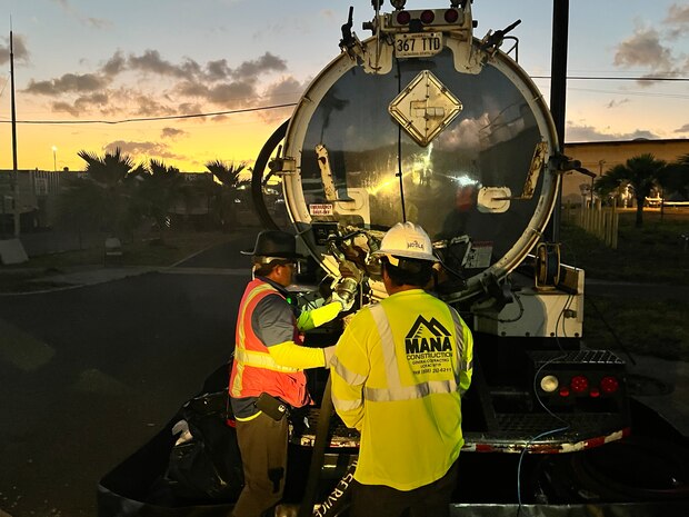 Personnel in support of Joint Task Force-Red Hill (JTF-RH) disconnect a fuel line from a truck used for moving the final gallons of accessible residual fuel from the Red Hill Bulk Fuel Storage Facility (RHBFSF), Halawa, Hawaii, March 6, 2024.