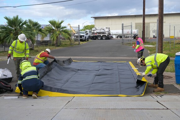 Personnel in support of Joint Task Force-Red Hill (JTF-RH) set up spill containment before defueling residual fuel at the Underground Pump House located on Joint Base Pearl Harbor-Hickam (JBPHH), Hawaii, March. 5, 2024