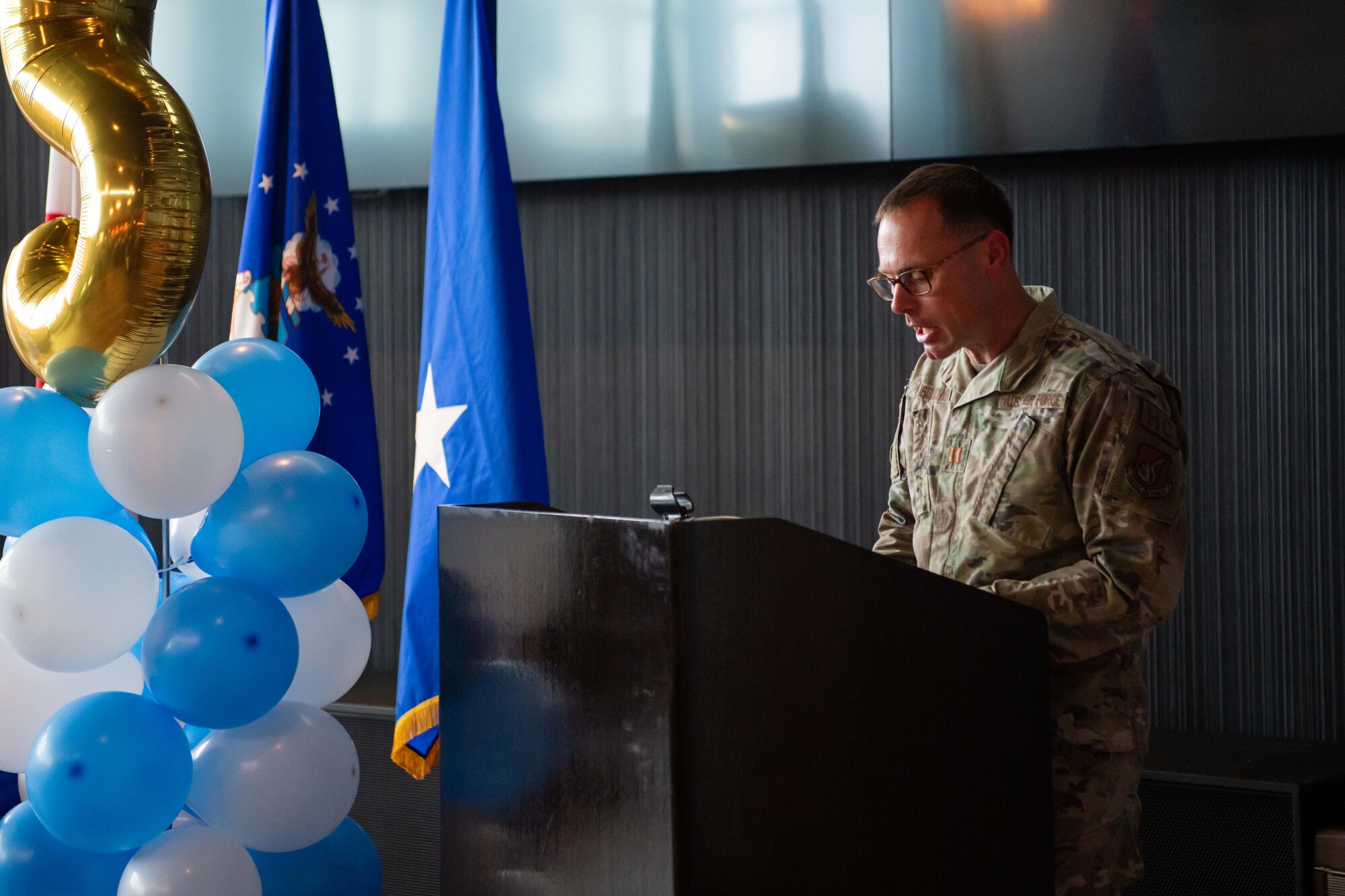 An 18th Wing chaplain leads a prayer.