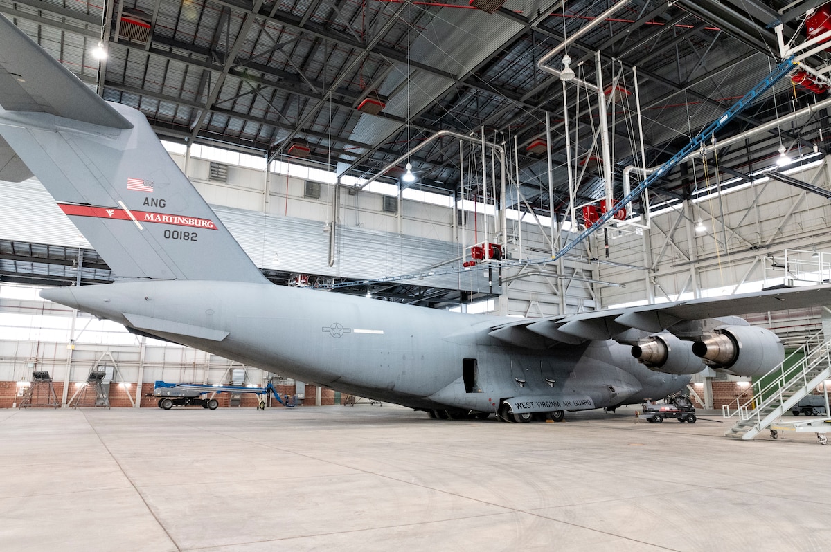 a cargo aircraft is parked in a hangar