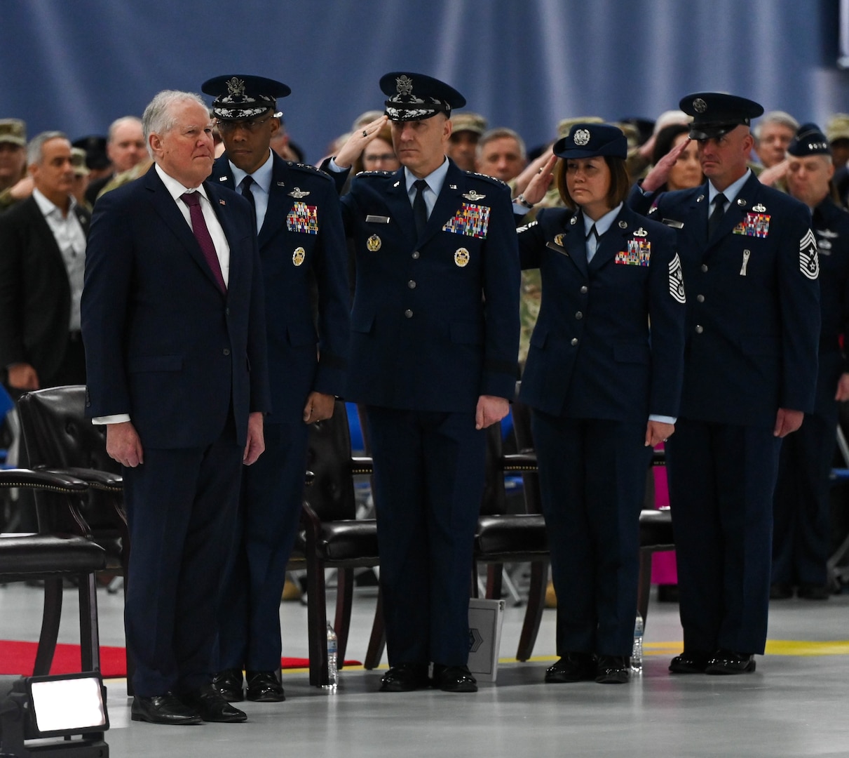 Secretary of the Air Force Frank Kendall is saluted during the Chief Master Sgt. of the Air Force transition ceremony