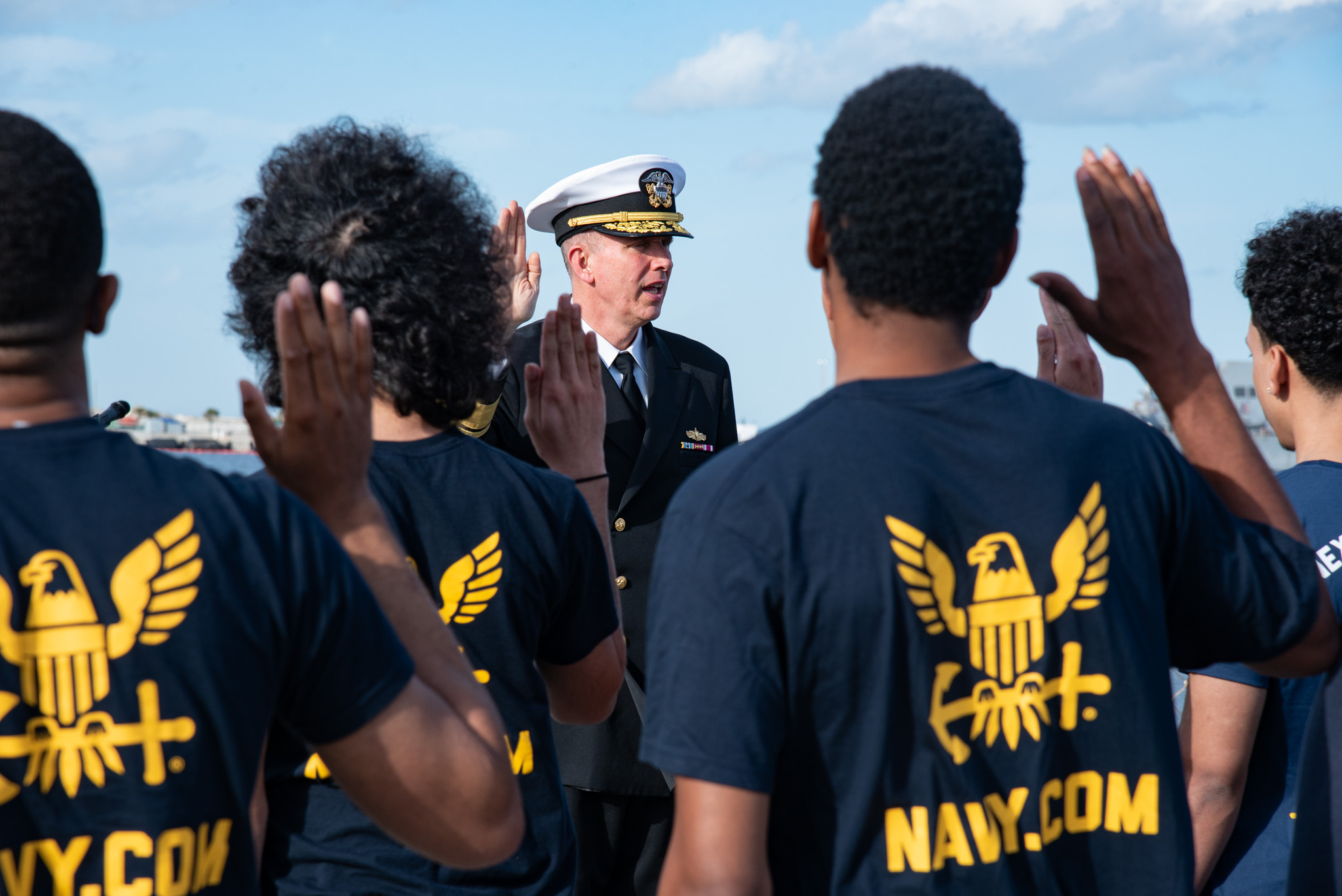 Rear Adm. James Aiken administers the oath of enlistment to future Sailors aboard USS Delbert D. Black (DDG 119) at Naval Station Mayport.