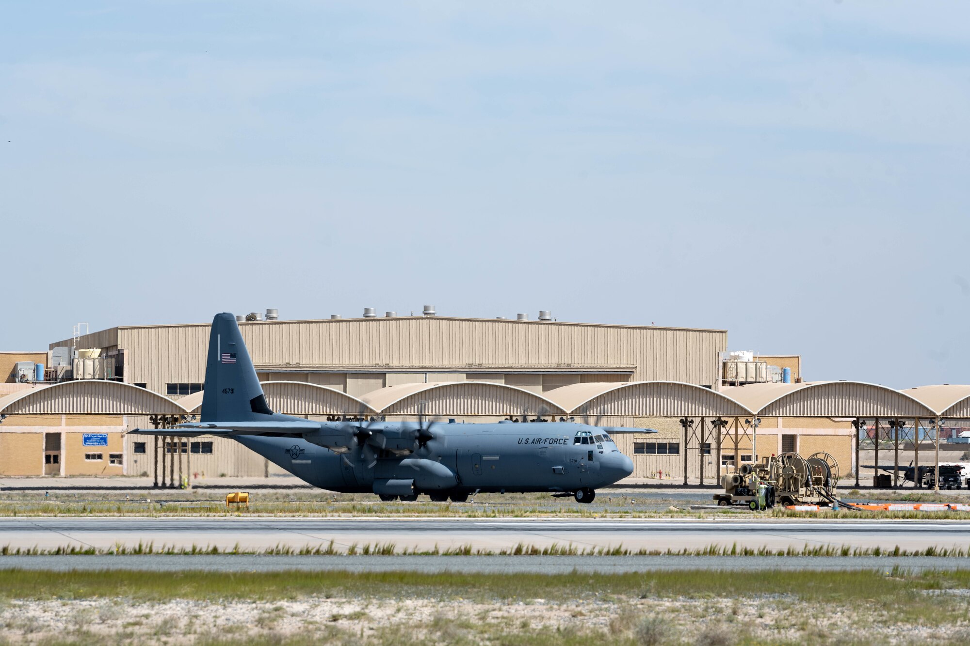 A C-130loaded with humanitarian aid bound for airdrop over Gaza taxis for takeoff from an undisclosed location.