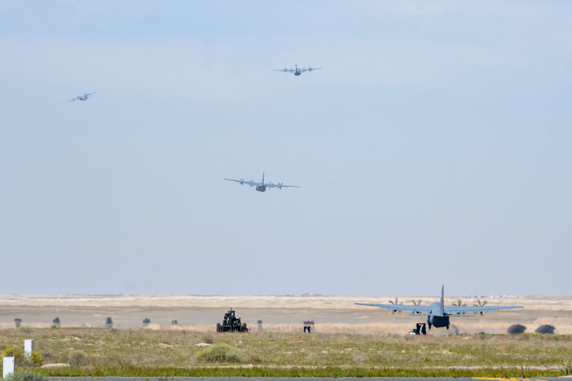 C-130s loaded with humanitarian aid bound for airdrop over Gaza take off from an undisclosed location.