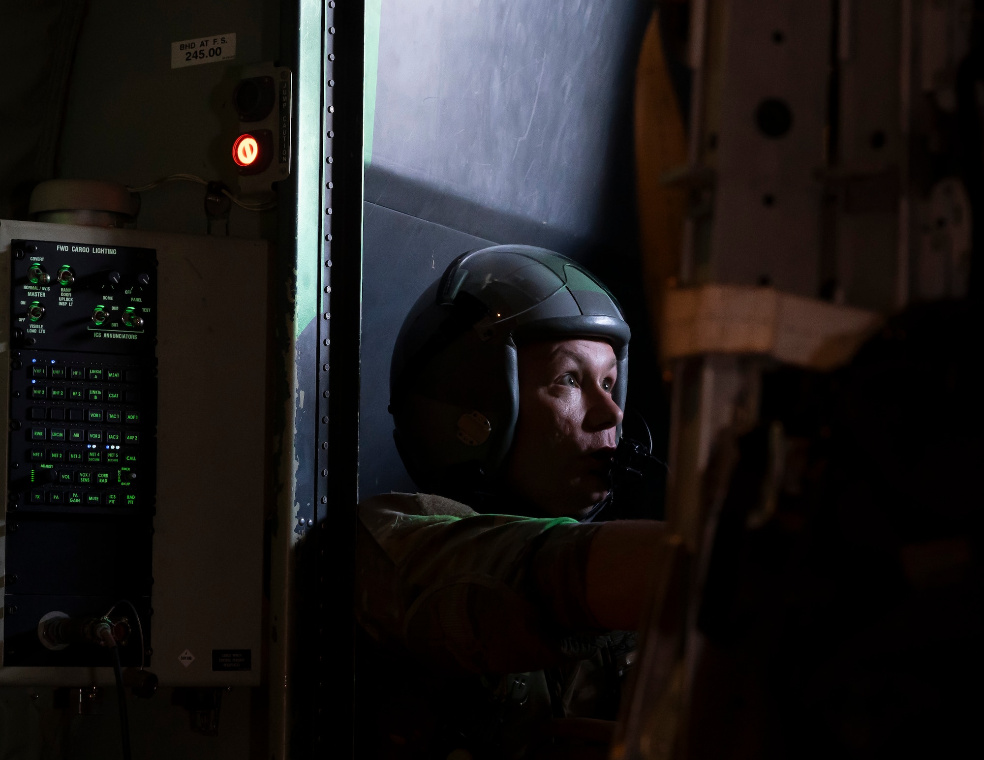 A loadmaster releases humanitarian aid pallets of packaged food and water supplies in several waves at multiple locations over Gaza.