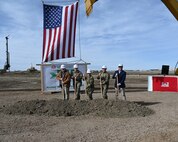 Leadership pose for a photo during a groundbreaking ceremony.