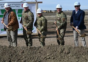 Leadership pose for a photo during a groundbreaking ceremony.