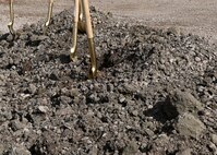 Shovels in the dirt after a groundbreaking ceremony.