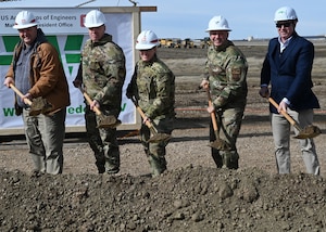 Leadership pose for a photo during a groundbreaking ceremony.