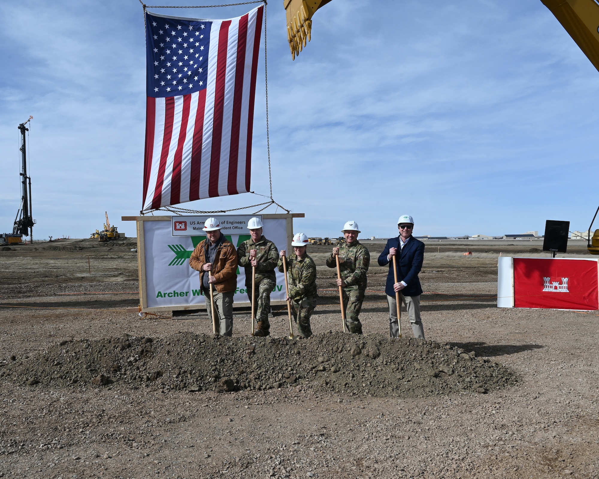 Leadership pose for a photo during a groundbreaking ceremony.