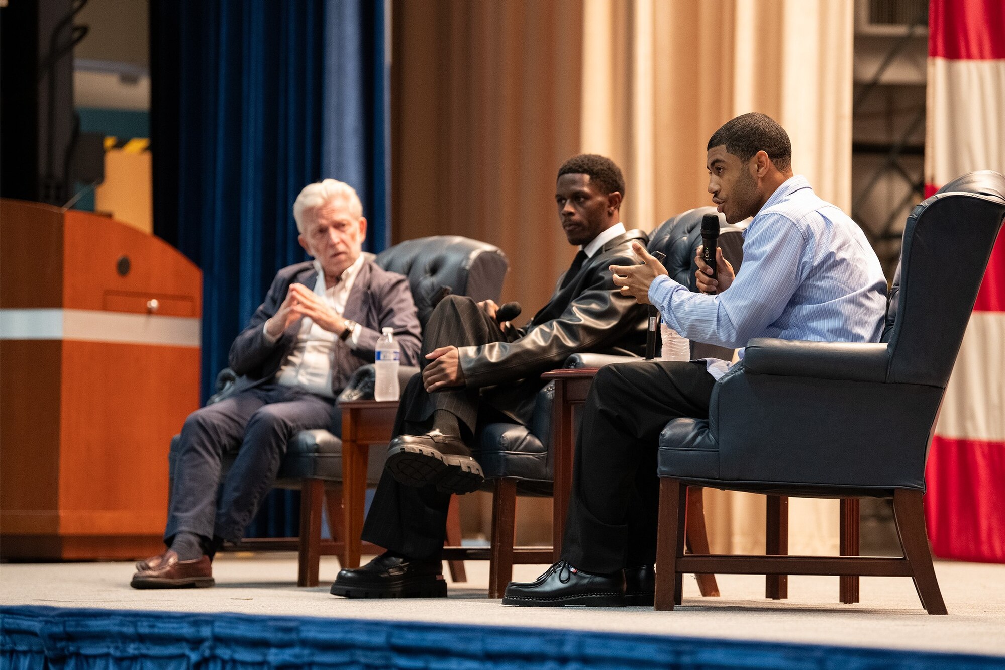 Masters of the Air producer, Kirk Saduski, and actors, Josiah Cross and Branden Cook talk on a panel at Maxwell Air Force Base, March 9, 2024. Prior to the viewing, a producer and cast members of the show were able to visit the 100th Fighter Squadron, located at Dannelly Field, Ala., to see a red-tail F-35 and a red-tail T-1 from the 99th Flying Training Squadron, a legacy Tuskegee Airmen squadron from Randolph Air Force Base, Tx.