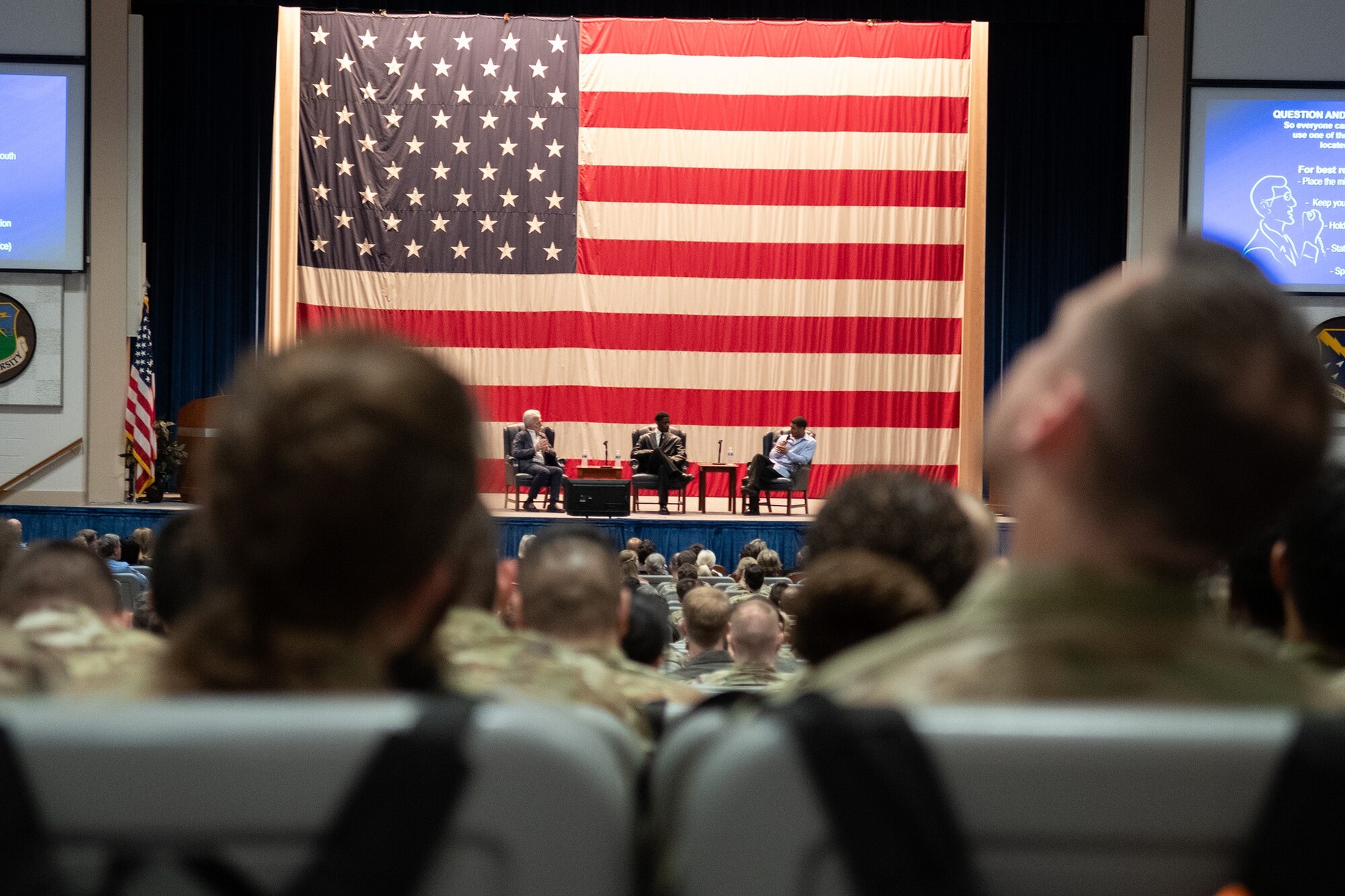 Masters of the Air producer, Kirk Saduski, and actors, Josiah Cross and Branden Cook talk on a panel at Maxwell Air Force Base, March 8, 2024.. After the screening, the floor was opened to the audience to ask questions to Masters of the Air producer, Kirk Saduski, and actors, Josiah Cross and Branden Cook, about their experiences portraying such an important moment in time, particularly featuring the Tuskegee Airmen. The screening also provided service members an opportunity to ask burning questions regarding what went into both producing and acting in the show.