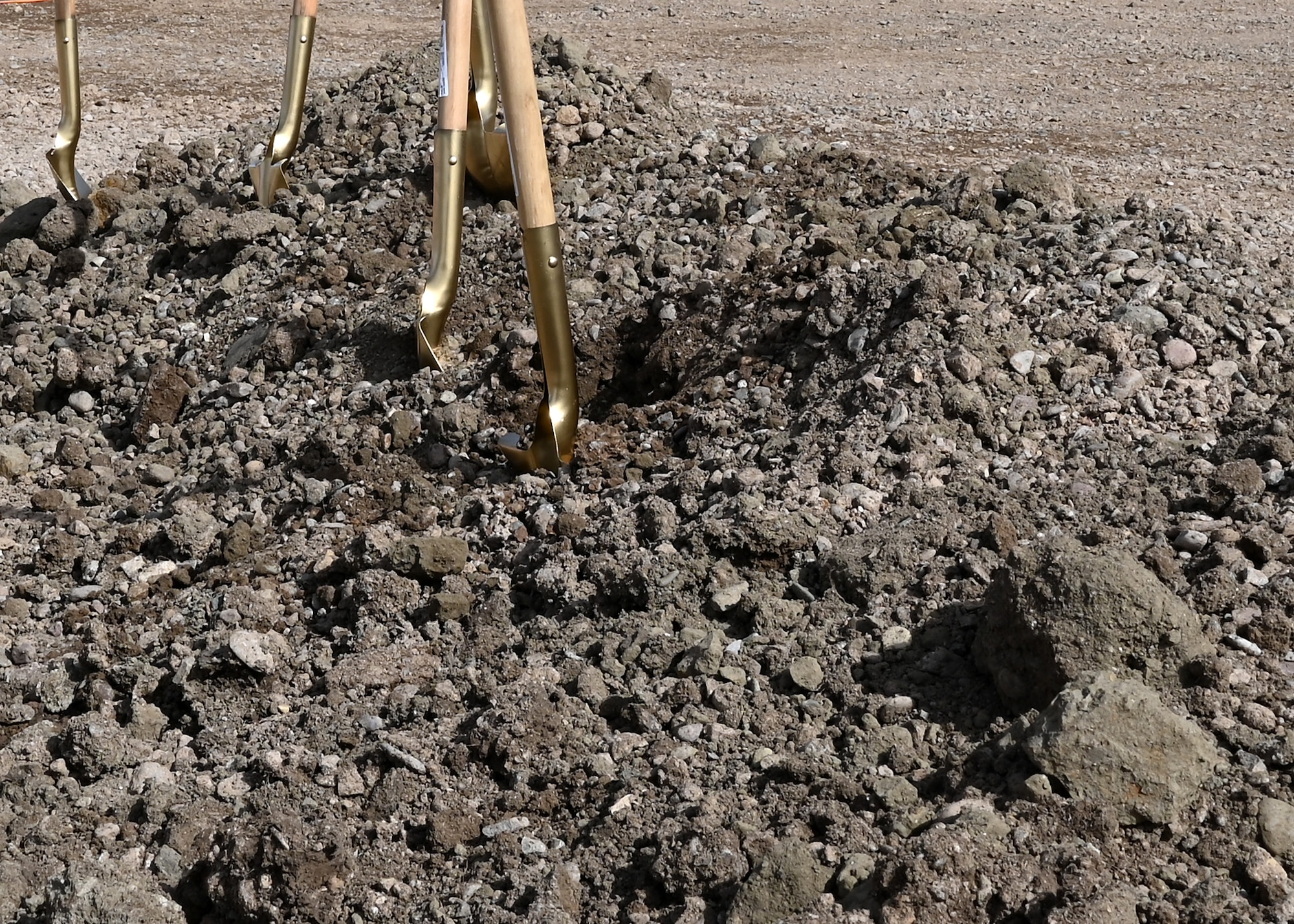 Shovels in the dirt after a groundbreaking ceremony.