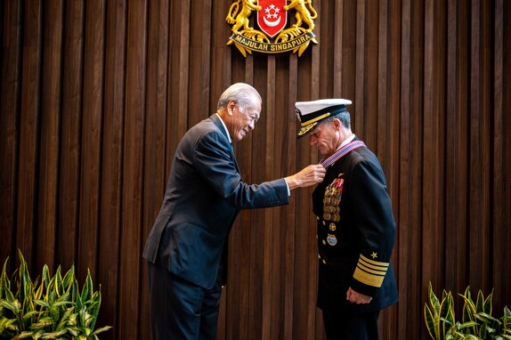 Singapore Minister of Defence Dr. Ng Eng Hen (left) presents Adm. John C. Aquilino, Commander of U.S. Indo-Pacific Command, with the Pingat Jasa Gemilang (Tentera) or Meritorious Service Medal (Military) at the Ministry of Defence headquarters in Singapore on March 7, 2024. Signed by Singapore President Tharman Shanmugaratnam, the award was given for “substantive contributions toward enhancing the strong and longstanding defence relationship between the United States and Singapore” and highlighted Aquilino’s role in increasing regional capacity building efforts, deepening people-to-people ties through inclusivity, and expanding cooperation in the digital domain. (U.S. Navy photo by Chief Mass Communication Specialist Shannon M. Smith)