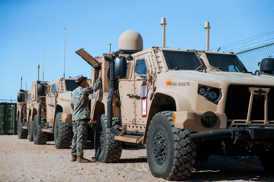 U.S. Marine Corps Cpl. Sam Kopotic,  a network administrator with 3d Marine Littoral Regiment, 3d Marine Division establishes a Network-On-The-Move at Marine Corps Air Ground Combat Center Twentynine Palms, California, Jan. 27, 2023. Marine Littoral Regiment Training Exercise is a large-scale, service-level exercise designed to train, develop, and experiment with the 3d MLR as part of a Marine Air-Ground Task Force, led by 3d Marine Division, operating as a Stand-in Force across a contested and distributed maritime environment. Cpl. Kopotic is a native from Madison, Wisconsin. (U.S. Marine Corps photo by Sgt. Patrick King)