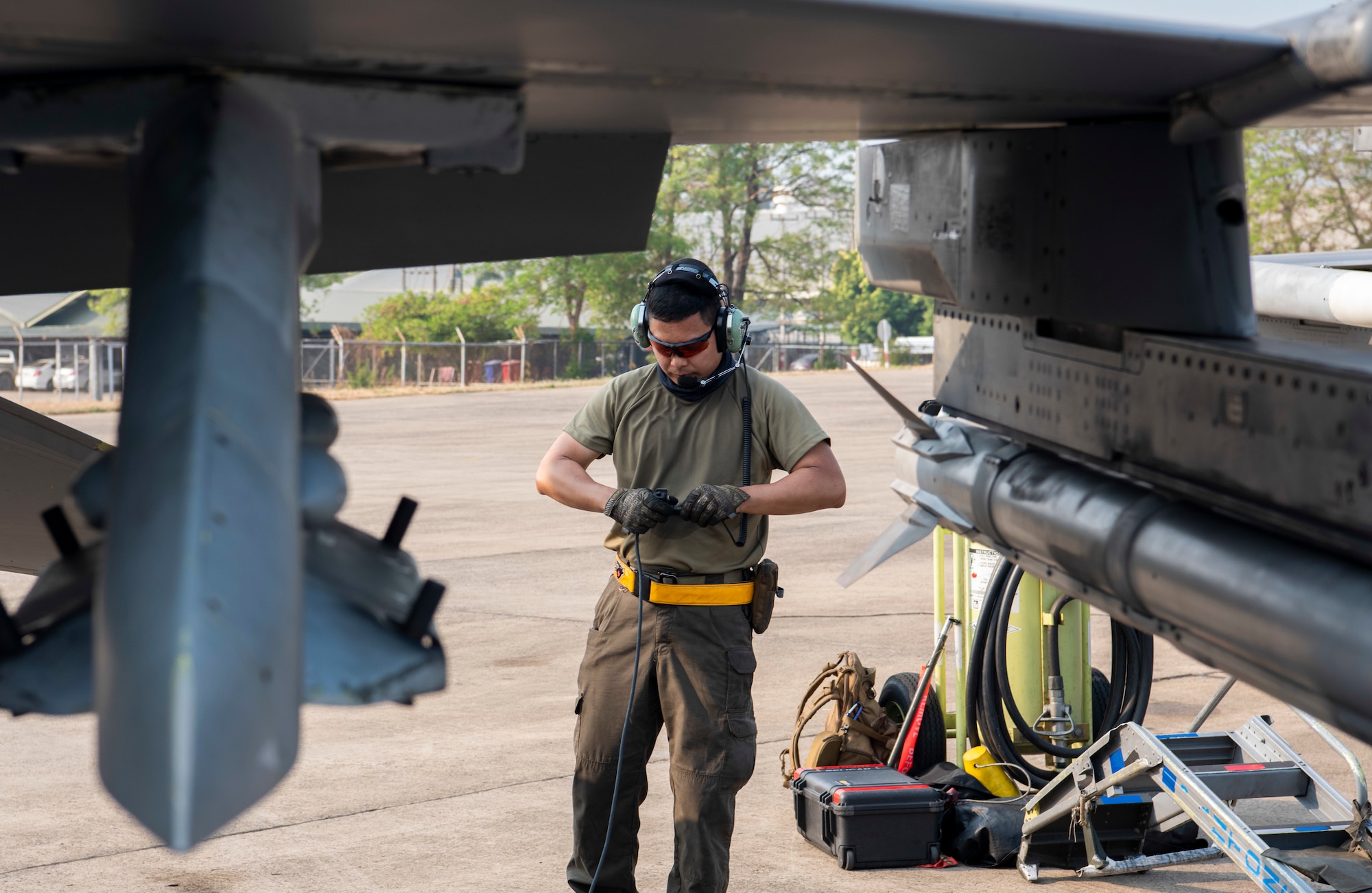Crew chief perfoms maintenance on an aircraft