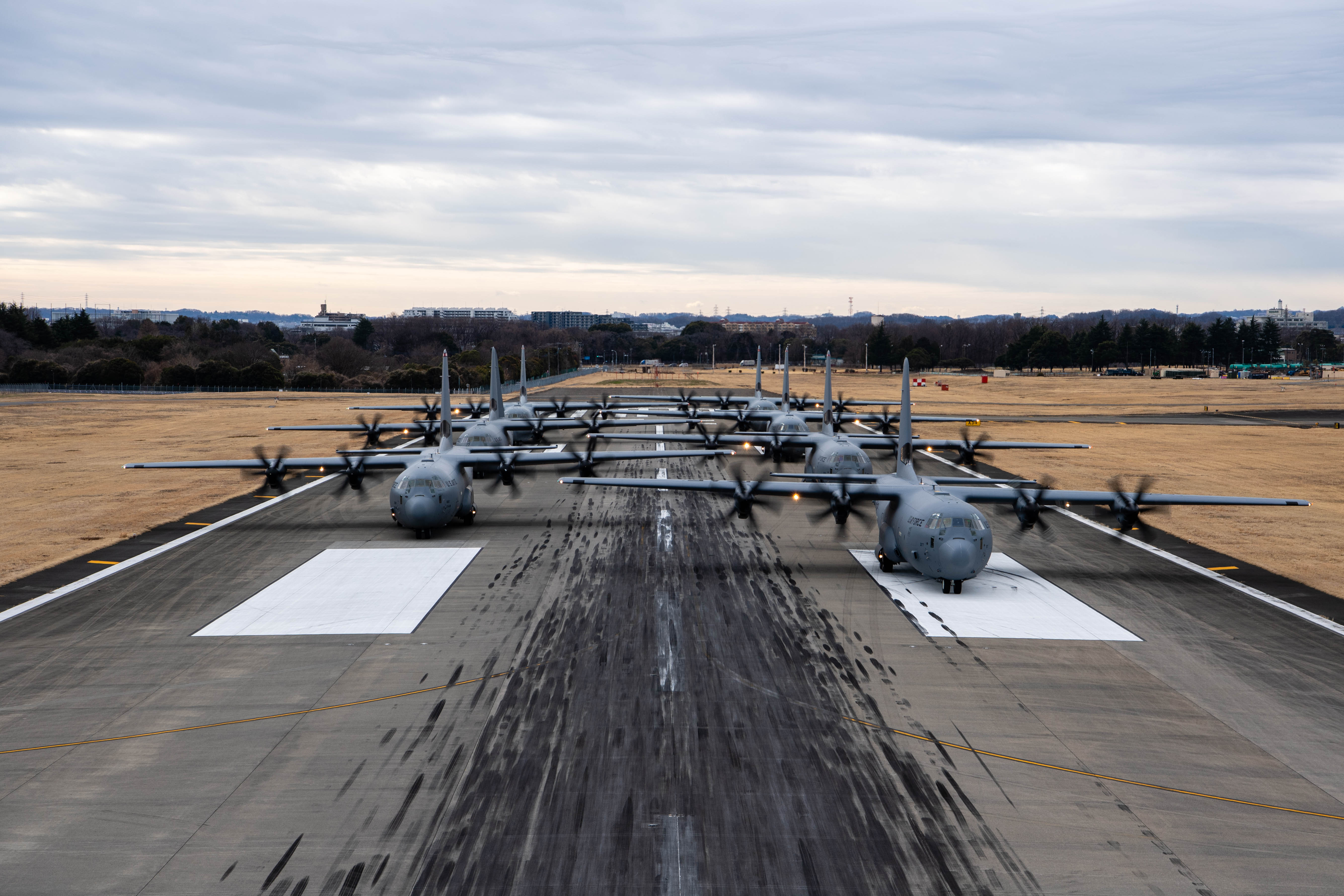 Seven U.S. Air Force C-130J Super Hercules aircraft assigned to the 36th Airlift Squadron participate in an elephant walk.