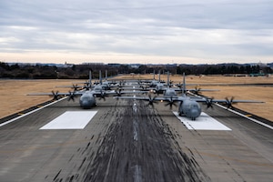 Seven U.S. Air Force C-130J Super Hercules aircraft assigned to the 36th Airlift Squadron participate in an elephant walk.