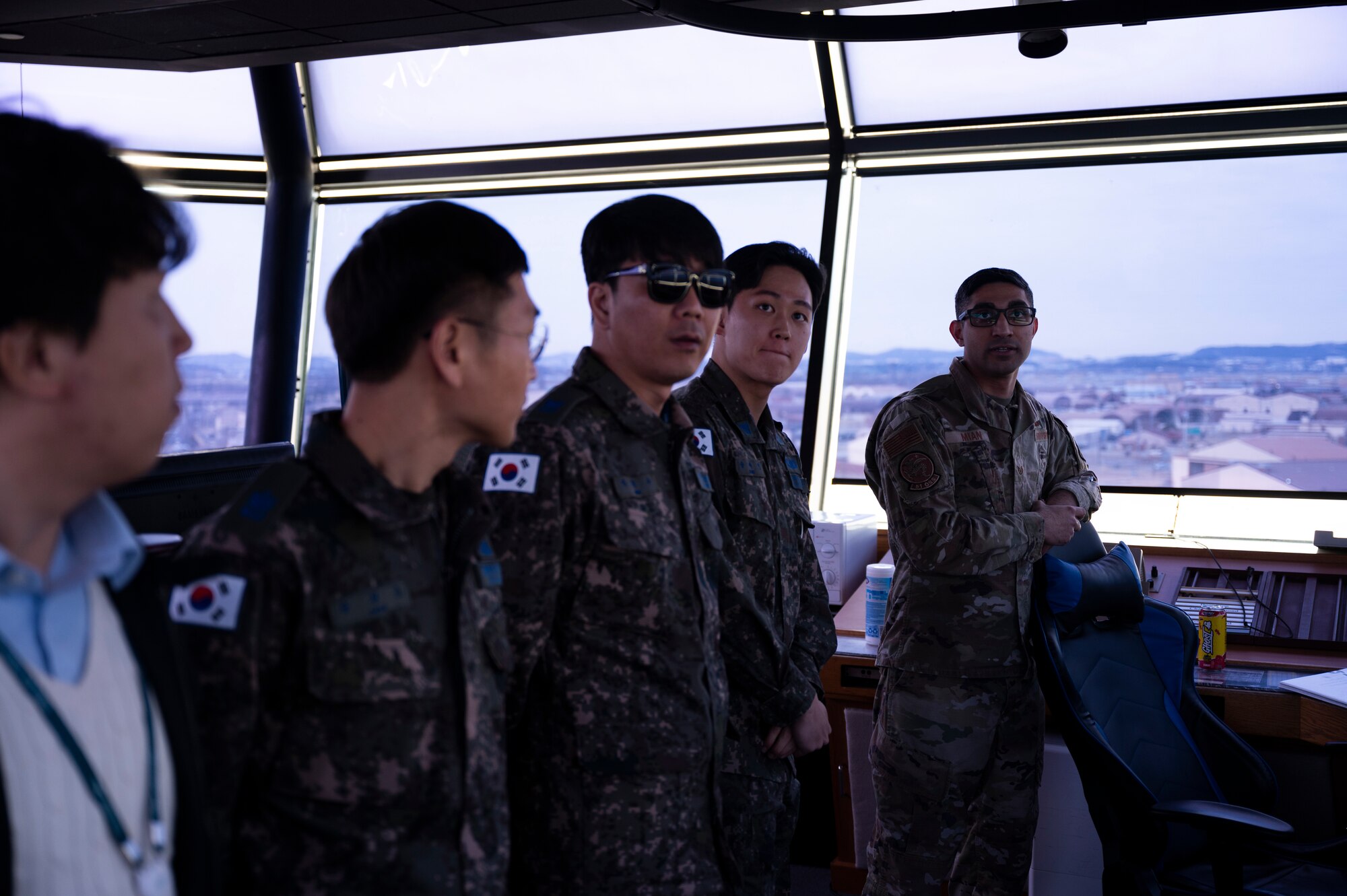 USAF and ROKAF Airmen in air traffic control tower.