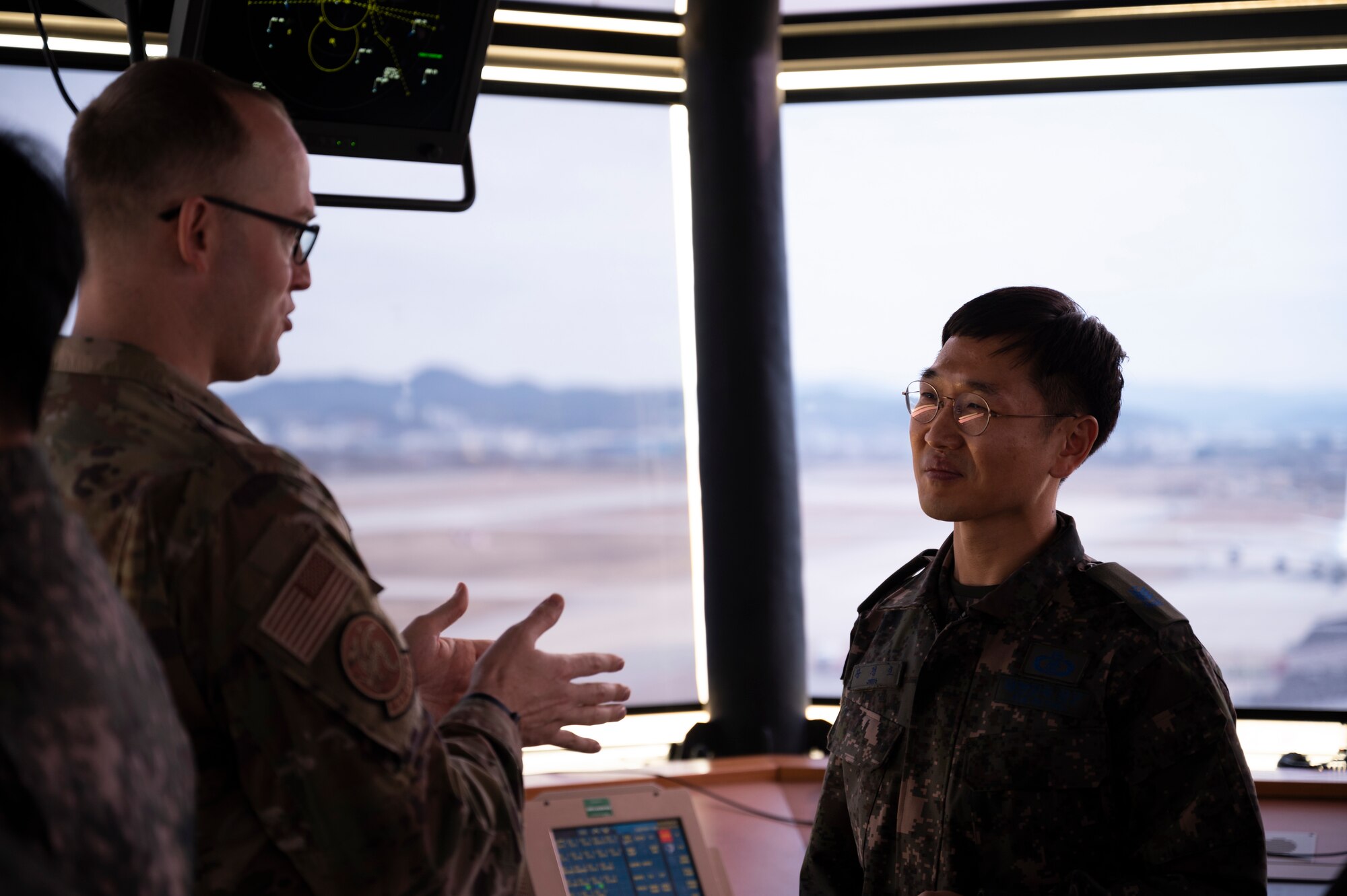USAF and ROKAF Airmen in air traffic control tower