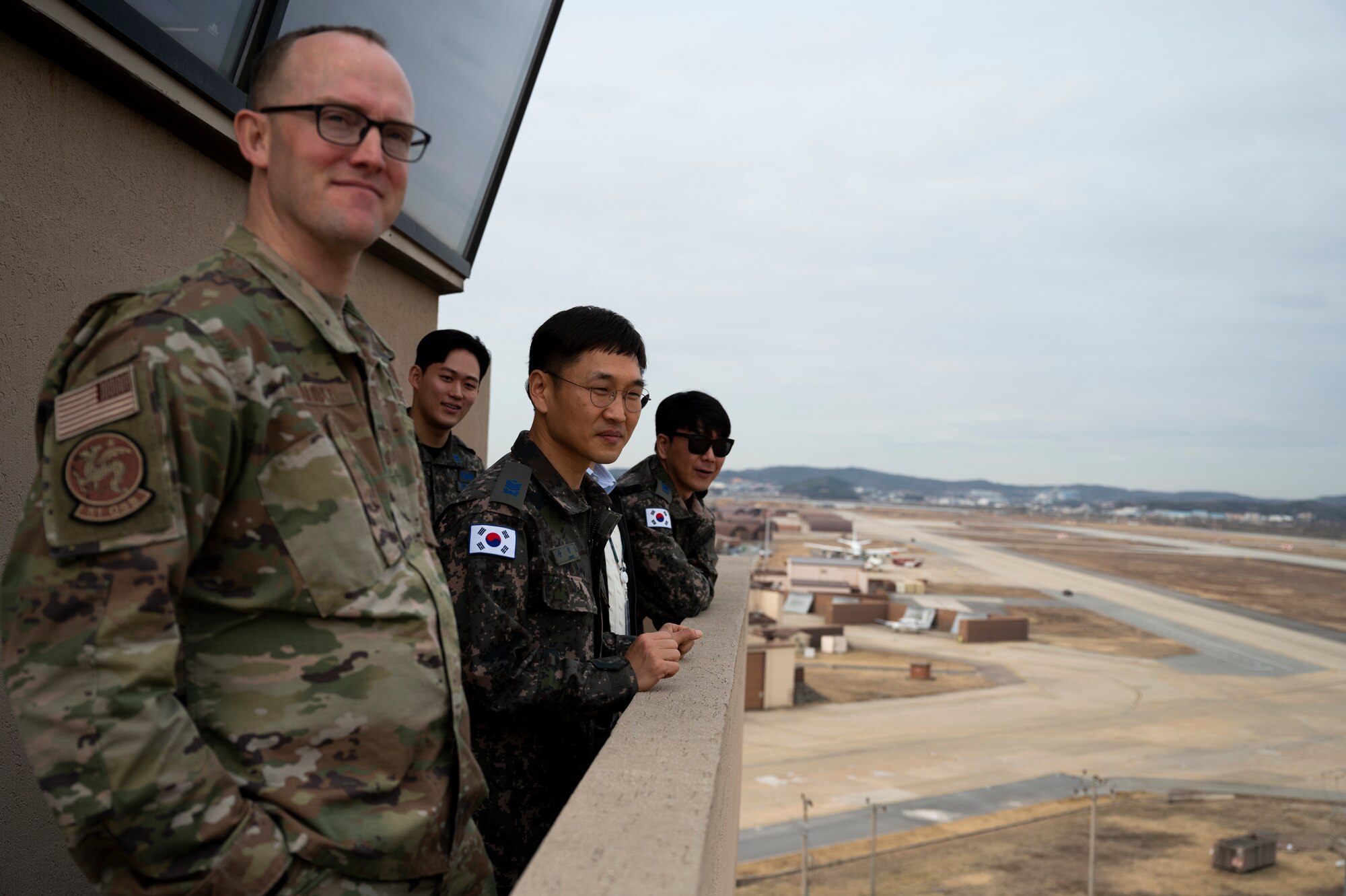 USAF and ROKAF Airmen overlook the Osan Air Base flightline.
