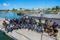 VICTORIA, Seychelles (March 5, 2024) Service members from partner nations participating in exercise Cutlass Express 2024 (CE 24) pose for a photo following Visit, Board, Search and Seizure (VBSS) training scenarios. Cutlass Express 2024, conducted by U.S. Naval Forces Africa and sponsored by U.S. Africa Command, increases the readiness of U.S. forces; enhances maritime domain awareness and collaboration among participating nations; and strengthens the capability of partner nations to combat piracy and counter illicit trafficking and illegal, unreported, and unregulated fishing. (U.S. Navy Photo by Chief Mass Communications Specialist Arif Patani)