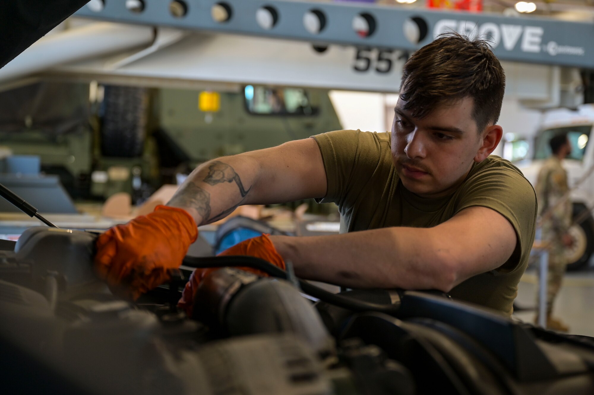 U.S. Air Force Airman 1st Class Jake Mendoza, a 1st Special Operations Logistics Readiness Squadron vehicle maintenance journeyman, performs maintenance on a vehicle.