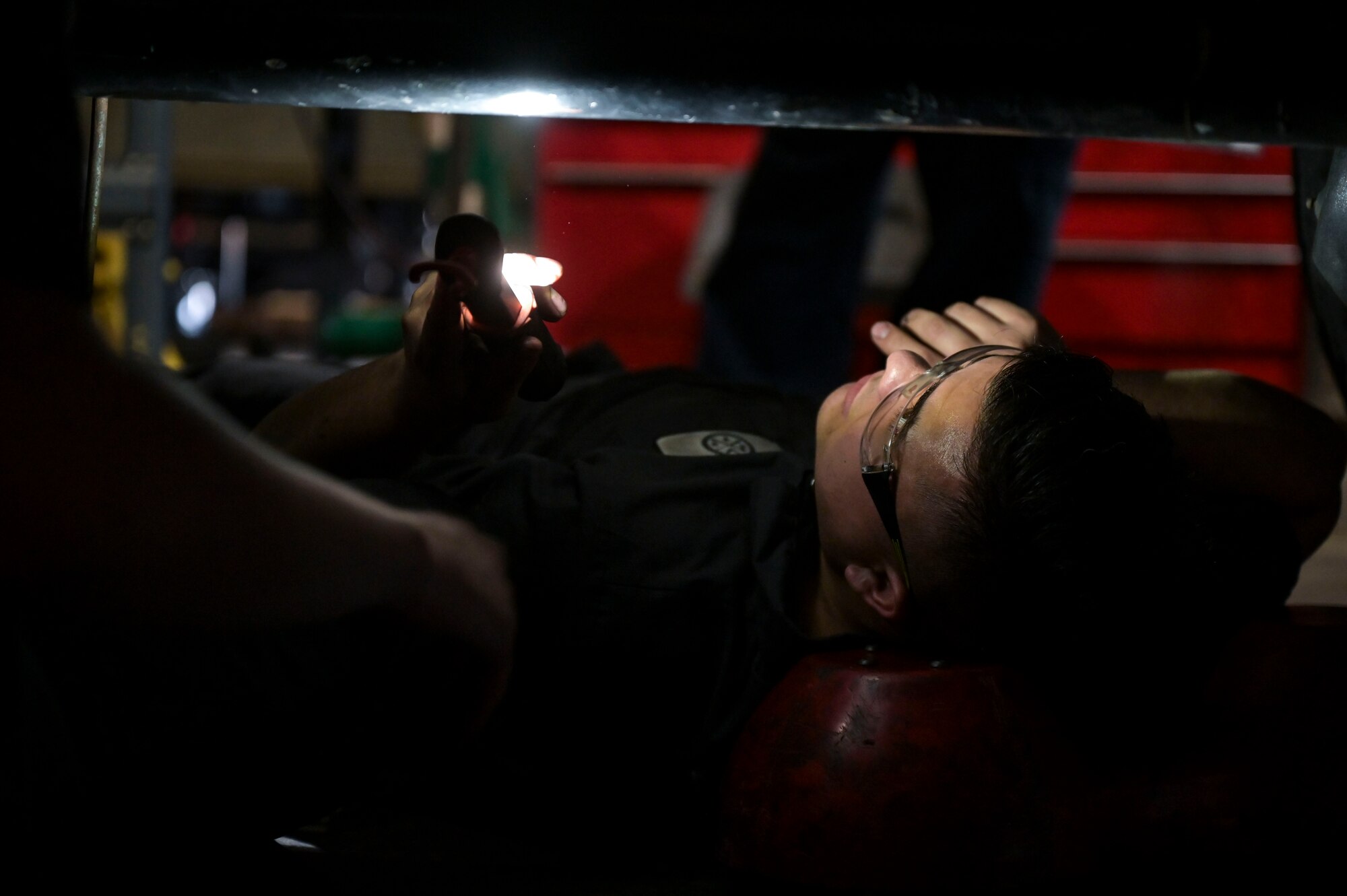 U.S. Air Force Senior Airman Felipe Sanchez, a 1st Special Operations Logistics Readiness Squadron firetruck and refuel technician, performs maintenance on a vehicle.