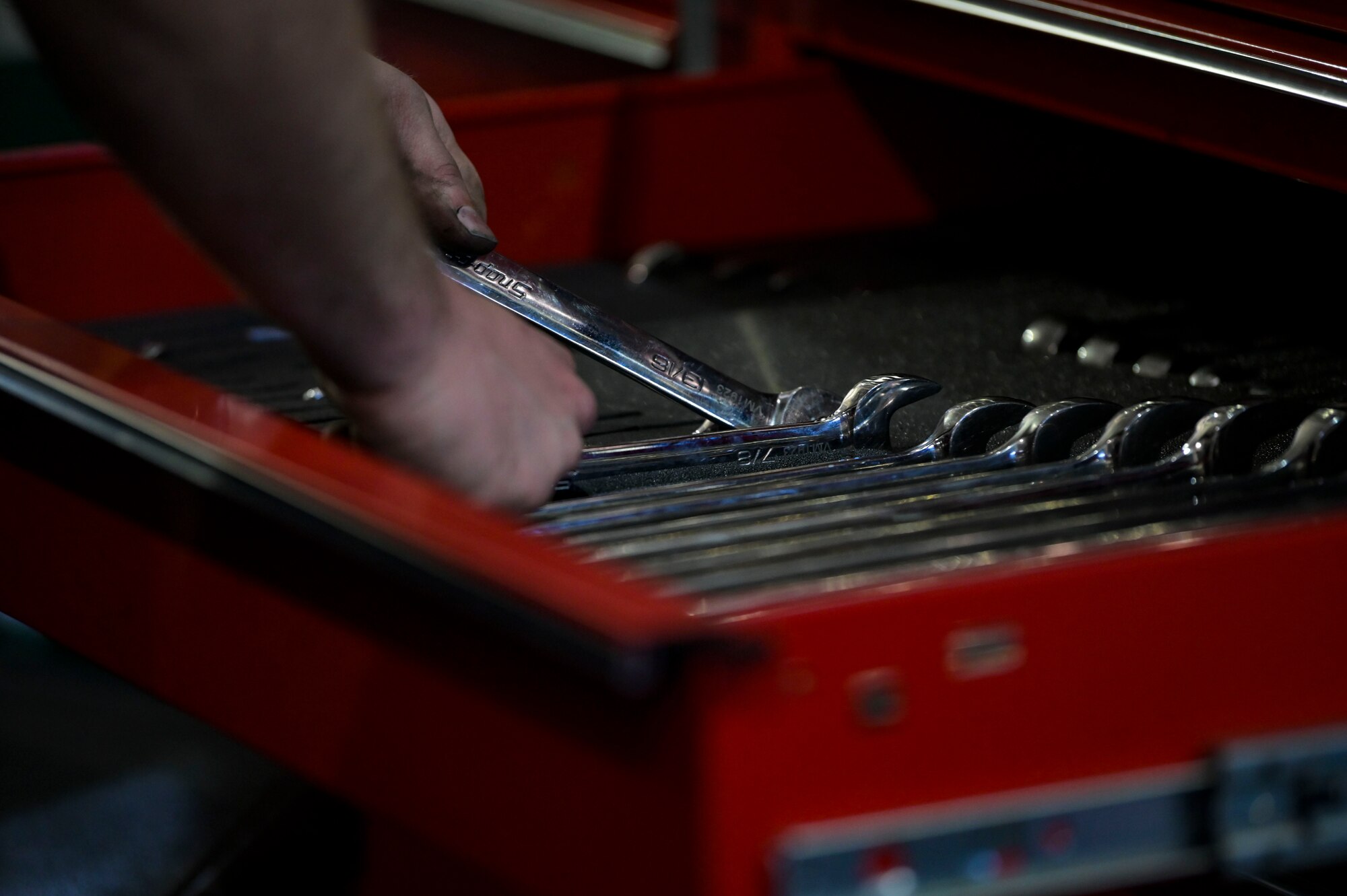 U.S. Air Force Staff Sgt. Robert Car, a 1st Special Operations Logistics Readiness Squadron heavy equipment mechanic, grabs a wrench.