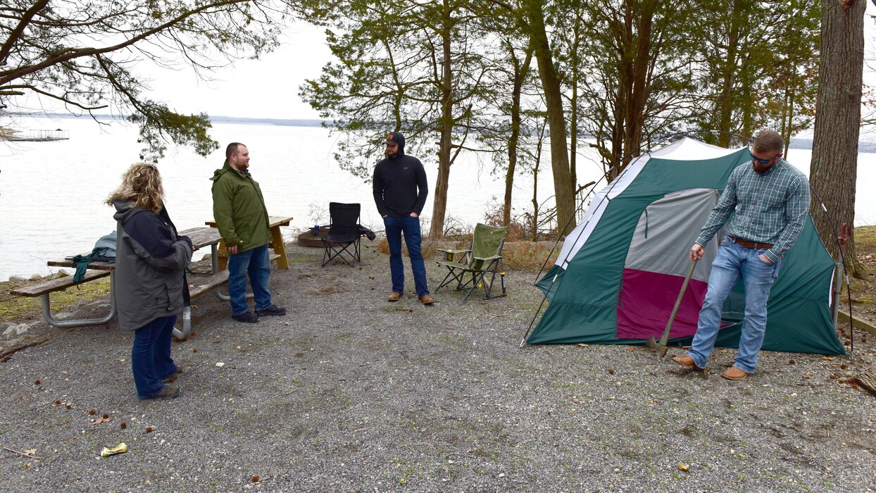 Cordell Hull Lake Park Ranger Ashley Webster (Left) and Hunter Humphrey (Second from Left) interact with actors during a visitor assistance training scenario March 6, 2024, at Canal Campground in Grand Rivers, Kentucky. (USACE Photo by Lee Roberts)