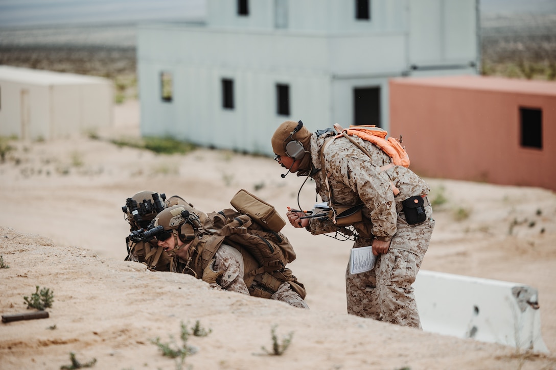 U.S. Marine Corps Sgt. Ruben Flores Jr., an Othello, Washington native, service level training instructor with Tactical Training and Exercise Control Group, Marine Air-Ground Task Force Training Command, Marine Corps Air-Ground Combat Center, instructs Marines with the training unit during an Adversary Force Exercise as part of Service Level Training Exercise 2-24 at Range 220, MCAGCC, Twentynine Palms, California, Feb. 1, 2024.