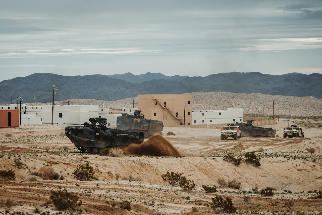 A U.S. Marine Corps Amphibious Assault Vehicle in support of 2nd Battalion, 6th Marine Regiment, 2nd Marine Division, drives through the training area at Range 220 during an Adversary Force Exercise as part of Service Level Training Exercise 2-24 at Marine Corps Air-Ground Combat Center, Twentynine Palms, California, Feb. 5, 2024. The purpose of AFX is to create a credible, realistic threat for the exercise forces participating in SLTE 2-24 to engage against during the upcoming Marine Air-Ground Task Force Warfighting Exercise in a force-on-force, unscripted wargame. (U.S. Marine Corps photo by Lance Cpl. Justin J. Marty)