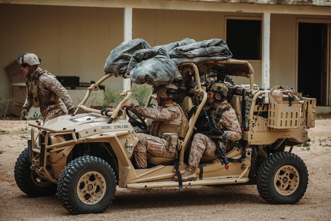 U.S. Marines with 2nd Battalion, 6th Marine Regiment, 2nd Marine Division, drive a Polaris MRZR during a company defense at Range 220 during an Adversary Force Exercise as part of Service Level Training Exercise 2-24 at Marine Corps Air-Ground Combat Center, Twentynine Palms, California, Feb. 5, 2024.