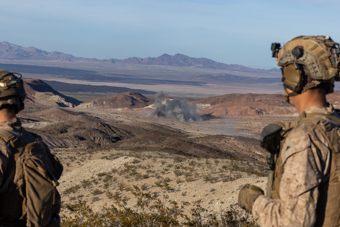 U.S. Marines with 2nd Battalion, 4th Marine Regiment, 1st Marine Division, observe fire support during a ground assault as part of a Marine Air-Ground Task Force Distributed Maneuver Exercise as part of Service Level Training Exercise 2-24 around Gays Pass training area, at Marine Corps Air-Ground Combat Center, Twentynine Palms, California, Feb. 14, 2024. MDMX prepares Marines for future conflicts by conducting offensive and defensive live-fire and maneuver training scenarios within an austere training environment. (U.S. Marine Corps photo by Lance Cpl. Anna Higman)