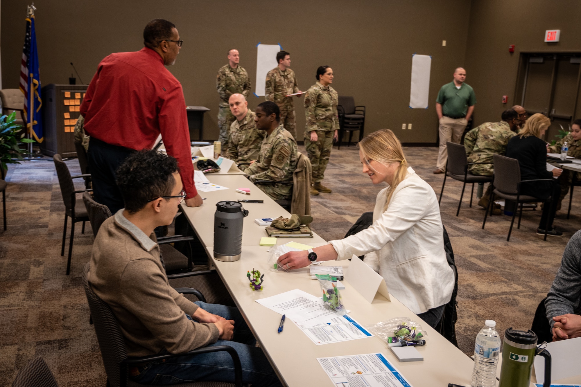 Participants of the Power of Practical Problem Solving one-day workshop work with Lego kits to simulate a micro-scale assembly line, Jan. 25, 2024, Scott Air Force Base, Illinois.  (U.S. Air Force photo by Christopher Parr)
