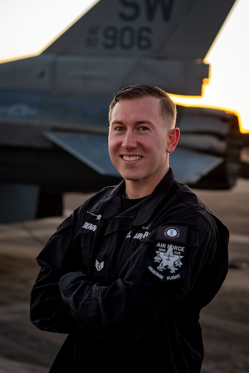 Airman poses for photo