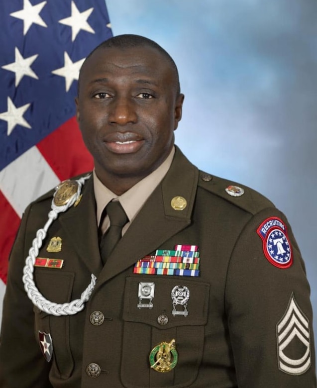 U.S. Army Soldier in AGSU Uniform in front of an American Flag