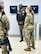 Two women in U.S. Army OCP Uniforms stand with two men in U.S. Army AGSU Uniforms.