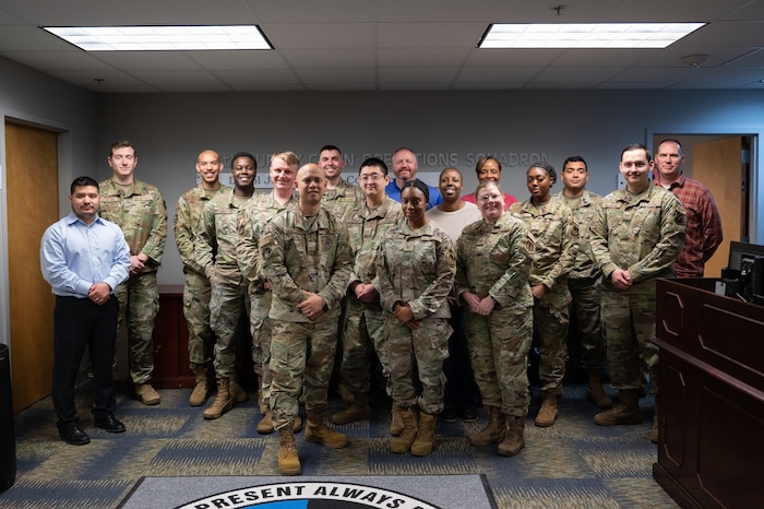 Members of the General Support Division Stock Fund Management Flight line up in the 435th SCOS office