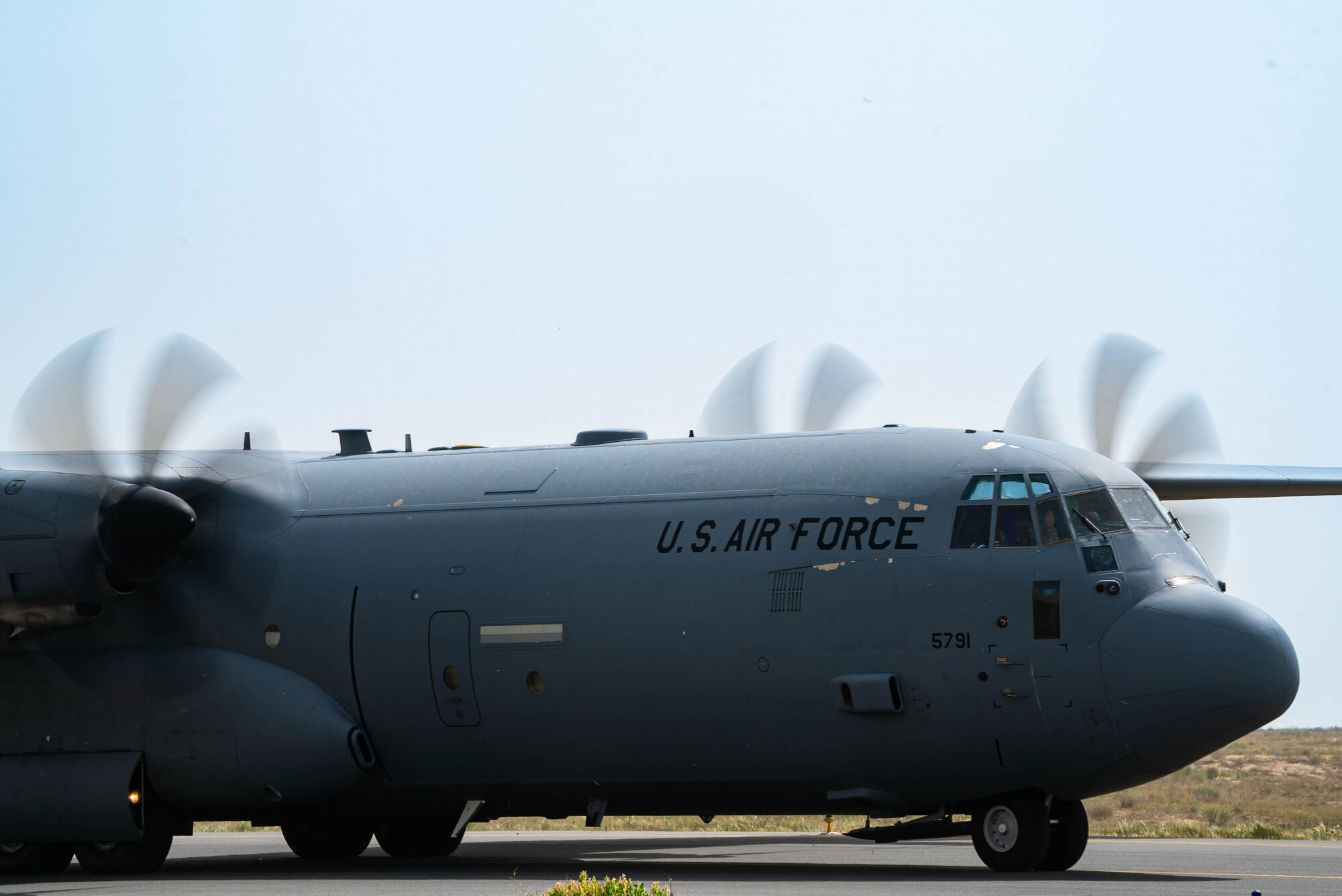 A C-130J aircraft loaded with humanitarian aid bound for airdrop over Gaza taxis from an undisclosed location.