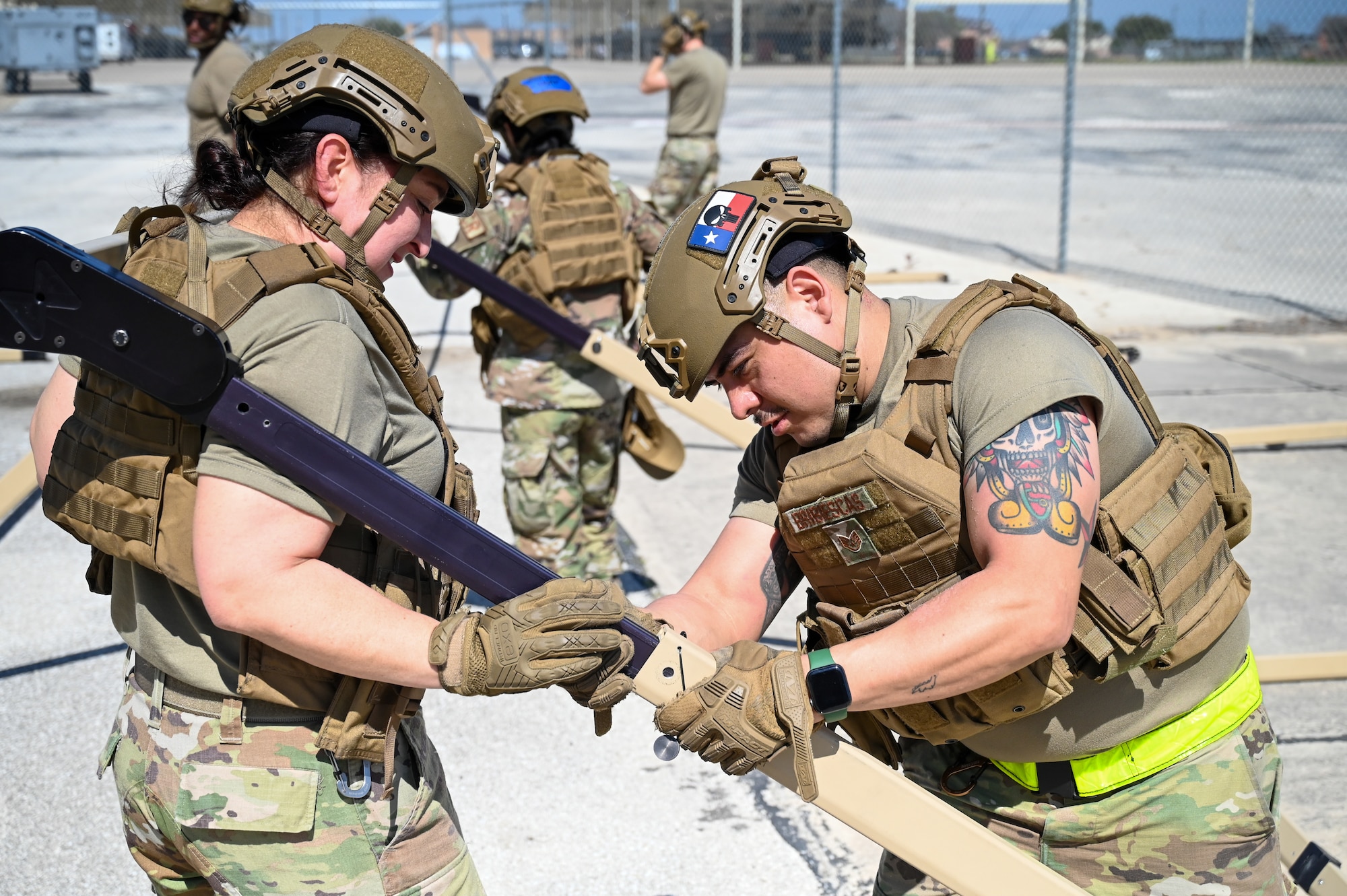 Members of the 433rd Contingency Response Flight set up equipment at a training campsite during a training event at Joint Base San Antonio-Lackland, Texas on Mar. 2, 2024.